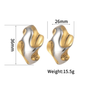 Minimalist two-tone wavy hoop earrings in gold and silver finish with polished metal texture
