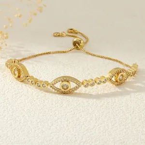 Detail of adjustable evil eye bracelet with 18K gold plating and shiny zircon stones