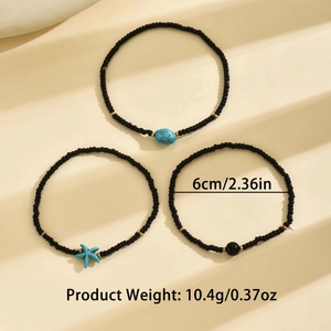 Detail view of 3-piece bohemian anklet set with turquoise starfish and black beads