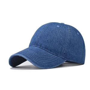 Close-up of blue washed denim baseball cap with durable stitching and six-panel structure
