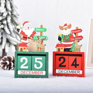 DIY Christmas wooden desktop calendar with Santa and reindeer on snow surface