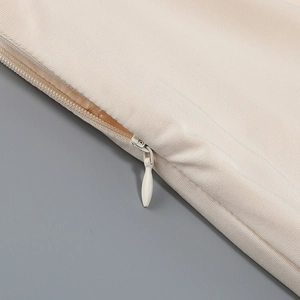 Macro shot of invisible zipper detail on off-shoulder mermaid dress fabric