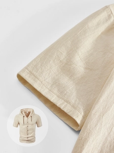 Detail of breathable cotton linen fabric texture and stitching on beige hooded short sleeve shirt