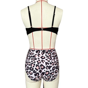 Rear view of high waisted leopard print bikini bottoms and black top on a mannequin