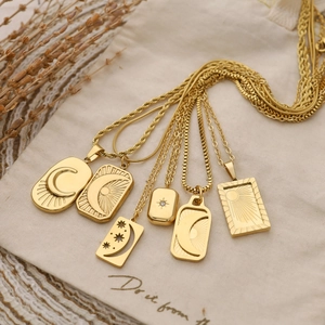 Set of six vintage gold-plated celestial pendant necklaces with sun and moon designs
