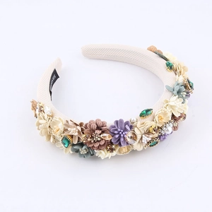 Detail of handmade Baroque sponge headband with 3D fabric flowers and crystals