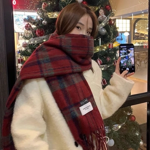 Chic red plaid scarf for women, thick and warm winter shawl in a festive holiday setting