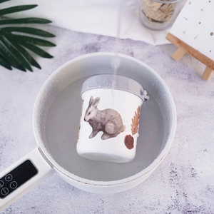 Detail showing vintage bunny pattern container undergoing high temperature water sterilization