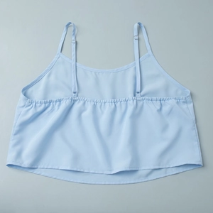 Detail of light blue lace camisole top with adjustable thin straps and elastic back