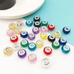 Detailed close-up of 13mm faceted resin beads with metal cores in various vibrant colors