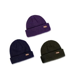 Cozy rib-knit beanie hats for kids with deer leather patch in purple, navy, and dark green