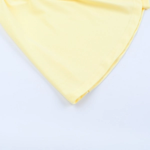 Detailed close-up of bright yellow fabric with high-quality double-needle hem stitching