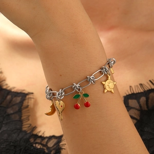 Silver chain bracelet with gold moon, heart, cherry, and sun charms for women