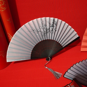 Classical Chinese bamboo folding fan with ink plum blossom painting and gray tassel