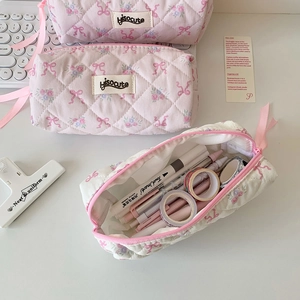 Quilted floral pencil case with pink ribbon bow and metal zipper for students
