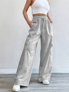 Women's grey high-waisted wide-leg cargo pants with drawstring and large side pockets