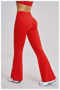 Macro detail of high-waist red flared yoga pants showing butt-lifting seam and fabric texture