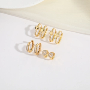 Minimalist gold huggie hoop earrings set featuring heart and star charms with cubic zirconia