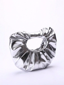 Detailed view of silver metallic pleated cloud bag with shiny faux leather texture