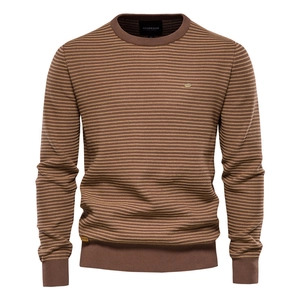 Detailed close-up of brown striped knit pattern on men's long sleeve crewneck sweater