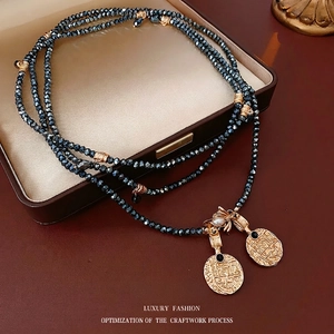 Vintage multi-layer sweater necklace with gold relief coins and grey-blue beaded chain