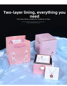 Pink jewelry gift set with shopping bag and double-layer storage box on blue silk fabric