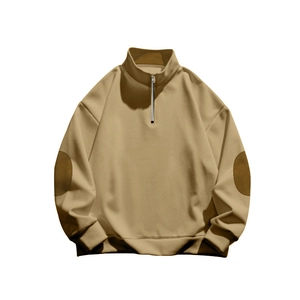 Detail of khaki half-zip sweatshirt featuring a stand collar and reinforced elbow patches