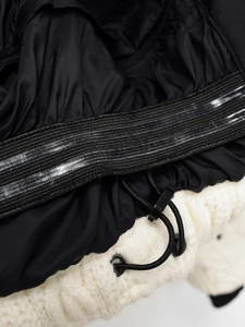 Detail of windproof ski jacket with non-slip elastic hem and toggle drawstring