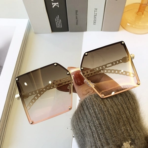 Square oversized sunglasses with brown gradient lenses and chain detail metal temples