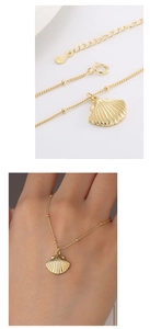 Macro detail of gold S925 sterling silver shell pendant necklace with bead chain