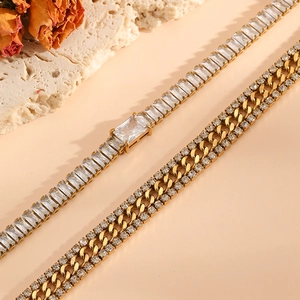 Detailed macro view of 18K gold plated tennis bracelet with square zircons and cuban link