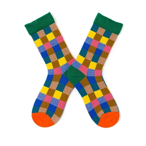 Macro detail of colorful checkered socks with green ribbed cuffs and orange toes