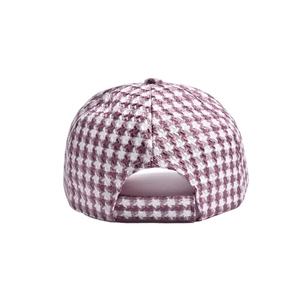 Rear view of a girls pink houndstooth baseball cap with adjustable strap and chic bow