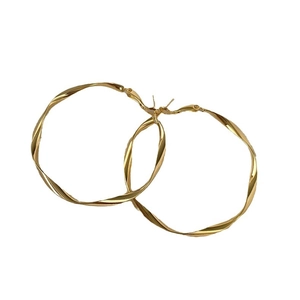 Golden geometric hoop earrings with spiral twist texture on a clean white background