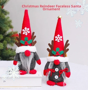 Detail of Christmas gnomes with reindeer antlers, red felt hats and jingle bell ornaments