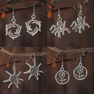 Vintage silver sea turtle dolphin octopus starfish flower drop earrings on branch