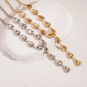 Irregular liquid lava style gold and silver triangle pea pendants on metal necklaces