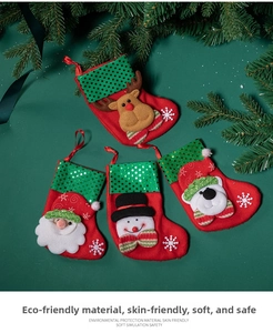 Detailed view of four Christmas stockings with sequined Santa, reindeer, and snowman dolls