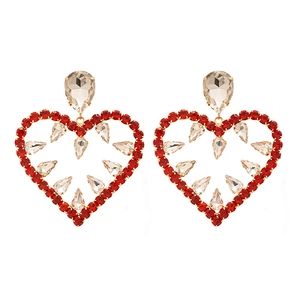 Exaggerated golden heart-shaped drop earrings with red and clear rhinestones