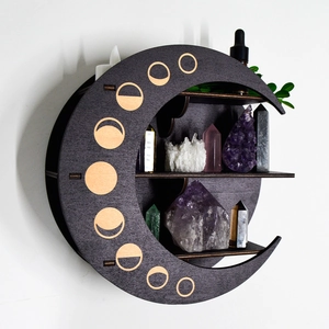 Three-tier moon shaped wooden wall shelf with phase cutouts for crystals and stones