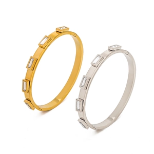 Minimalist 18k gold and silver stainless steel open bangle set with rectangular zirconias