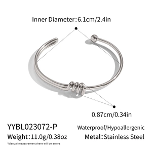 Detailed view of silver stainless steel knot bracelet with 6.1cm inner diameter size guide