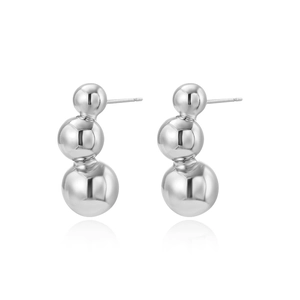 Detail view of graduated triple silver beads with a high-polished mirror finish and studs