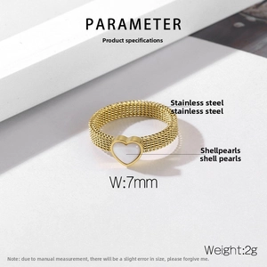 Detail of 7mm gold mesh band ring featuring a heart-shaped mother of pearl inlay