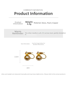 Detailed specs showing a golden C-shape earring with amber glass and large white pearl
