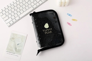 Close-up of black glitter PVC A5 binder with pear pattern and secure zipper closure