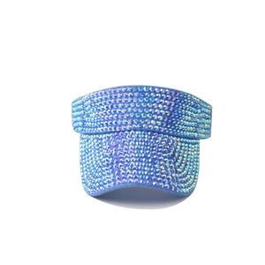 Detailed close-up of light blue sun visor hat fully embellished with holographic rhinestones