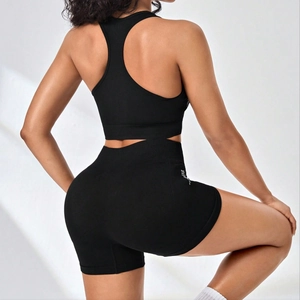 Black seamless two-piece sports bra and high-waist shorts set for fitness and running