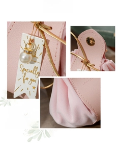 Detail of pink PU leather and velvet wedding candy bag with pearl charm and golden cord
