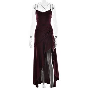 Detailed view of dark red satin dress showing delicate straps and ruffle hem design